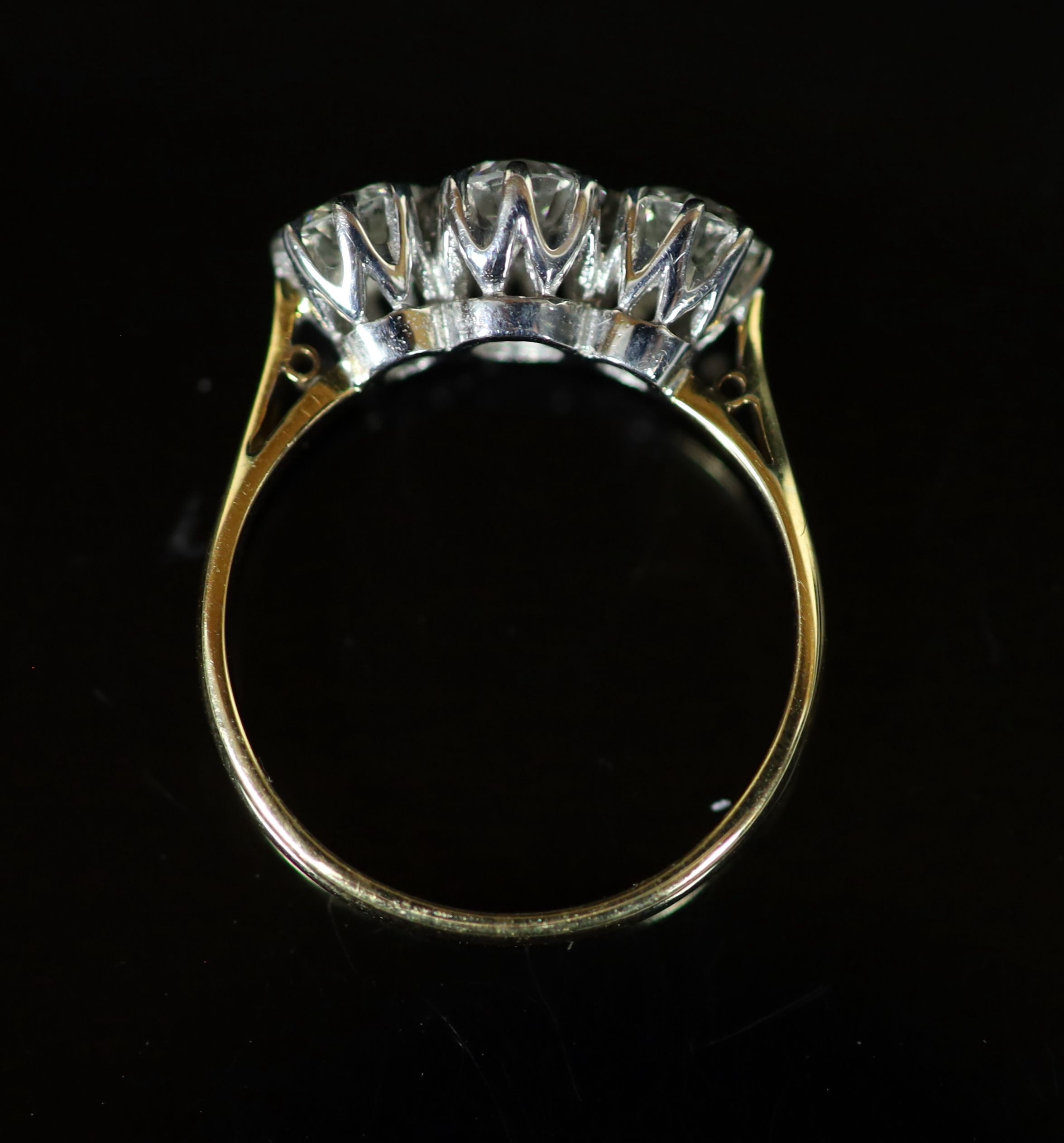 A 18ct gold and platinum, three stone diamond ring